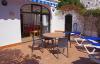 The terrace of the villa offers 4 sun beds, an outdoor shower, table and chairs and a barbecue.